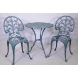 A painted metal garden table and two chairs, 60 cm diameter