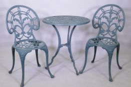 A painted metal garden table and two chairs, 60 cm diameter