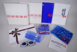 A collection of Swatch watch catalogues/indexes, years '88-92 (x 2), '93 and '94, and a collection