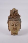 A Chinese carved, painted and distressed Quan Yin head bust, 23cm high