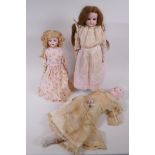 An Armand Marseille bisque headed doll, No 370 5/0, with sleeping eyes, circa 1900, together with