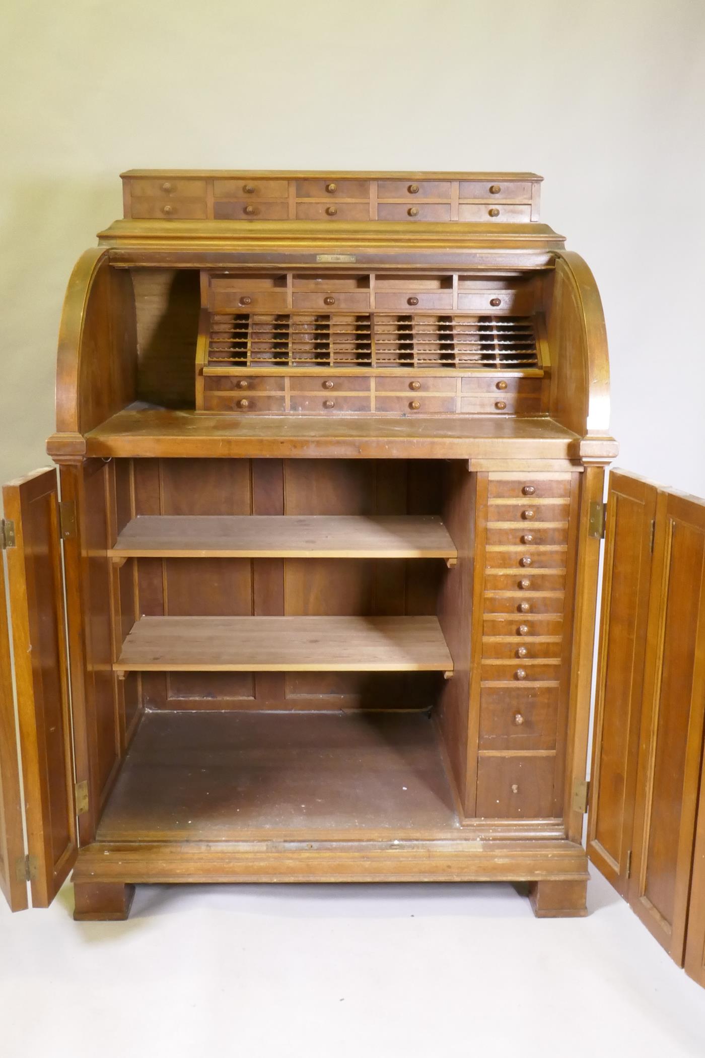 A late C19th/early C20th walnut tobacconist's shop cabinet, the roll top opening to reveal drawers - Image 2 of 5