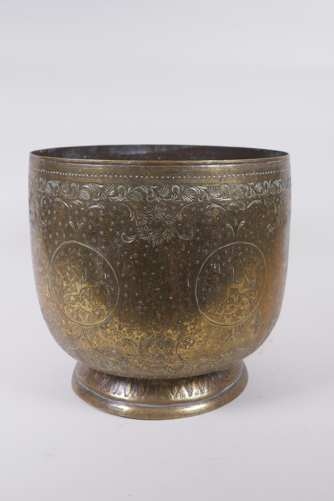 An antique Indo Persian brass planter with chased and hammered decoration of dancing figures and - Image 3 of 5