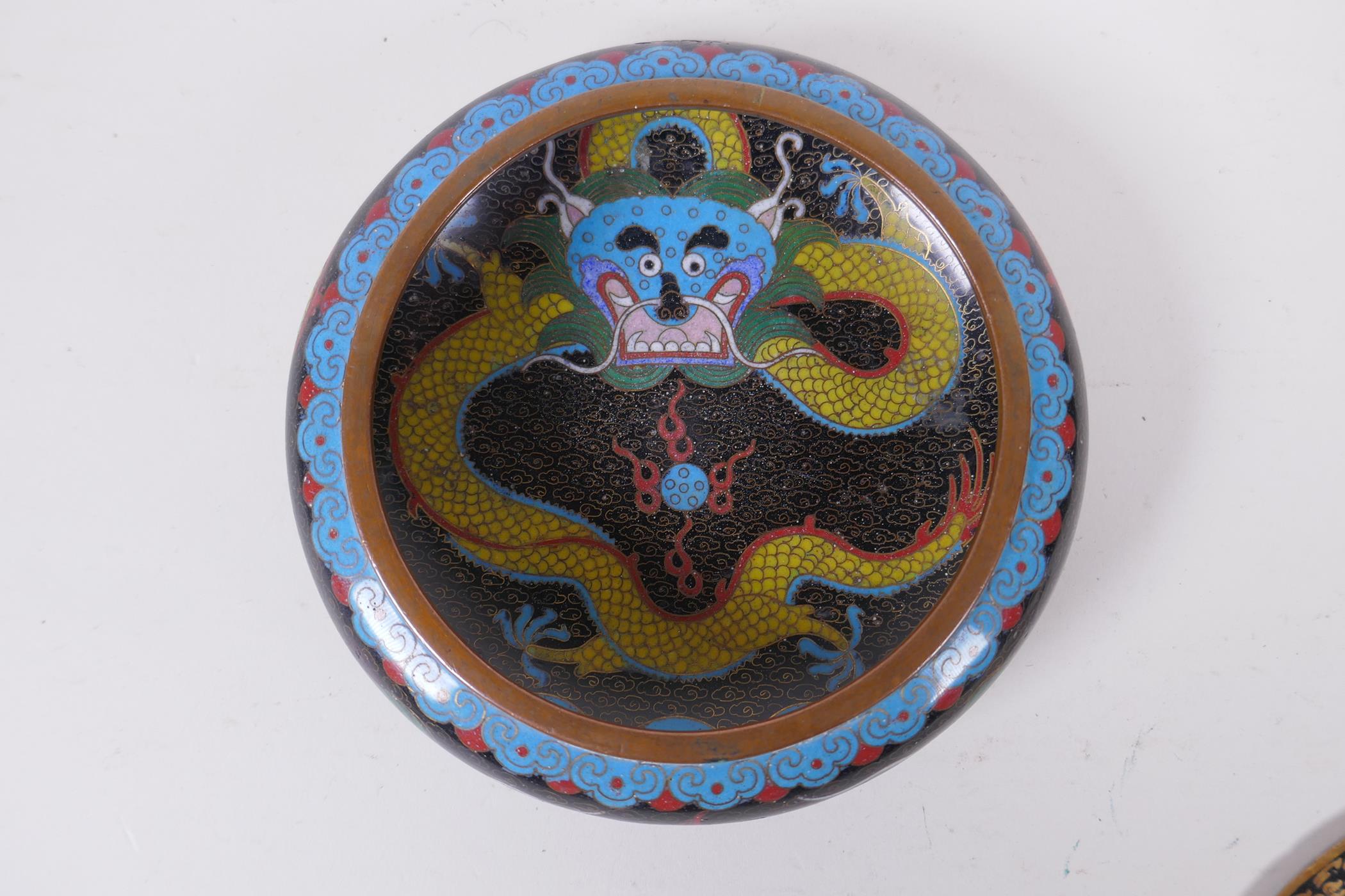 A Chinese black ground cloisonne bowl with rolled rim and dragon decoration, and a pair of Thai oval - Image 4 of 7