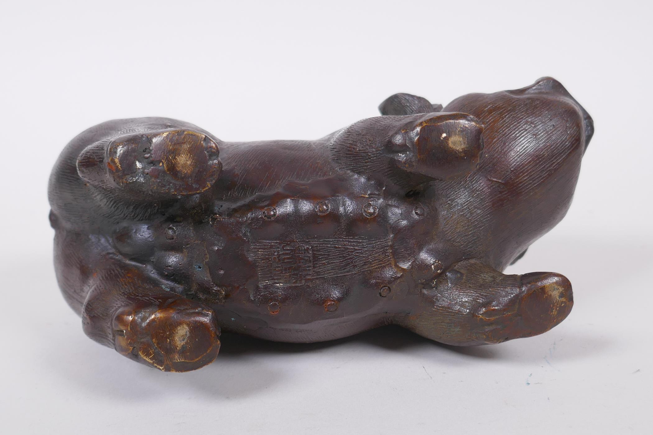 A Chinese filled bronze figure of a sow, impressed seal mark to base, 18cm long - Image 4 of 5