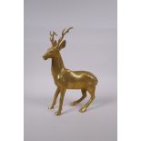 A filled gilt bronze figure of a stag, 29cm high