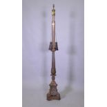 A copper and bronzed metal floor lamp with fluted column and Renaissance Revival style decoration,
