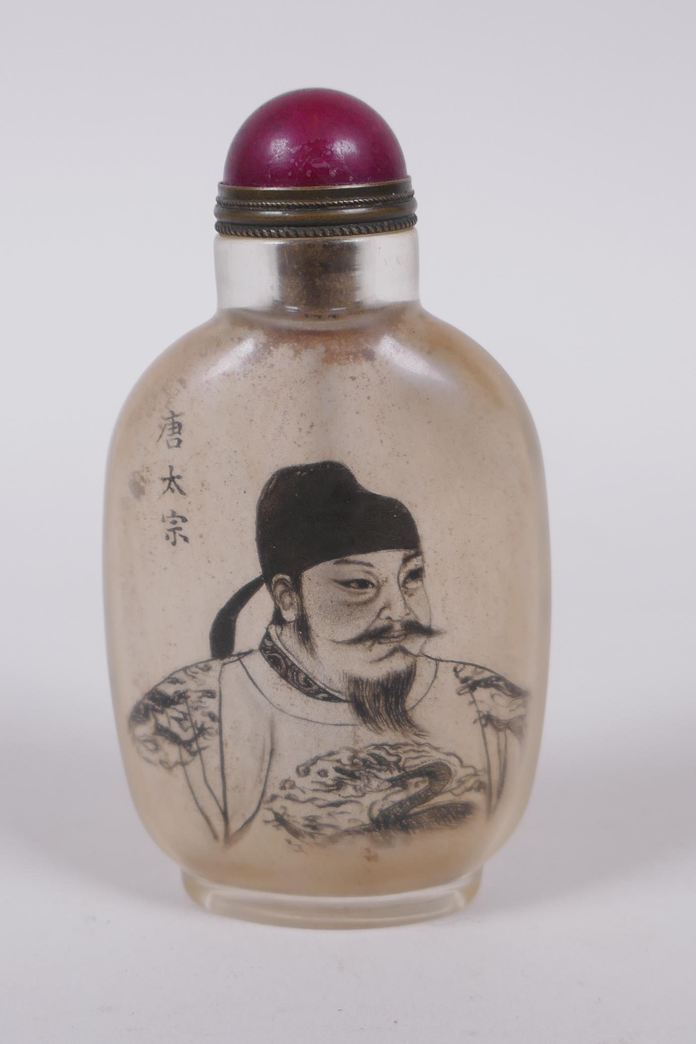 A Chinese reverse decorated glass snuff bottle with a portrait of an emperor, 9cm high