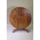 A C19th mahogany tilt top breakfast table, raised on a shaped column and tri-form platform base with