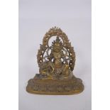 A Sino Tibetan bronze figure of a wrathful deity, seated on the back of a kylin, 20cm high