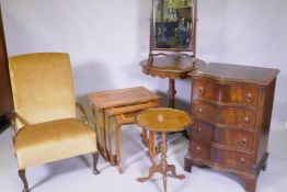 A small mahogany serpentine front chest of four drawers, a Victorian rosewood occasional table,