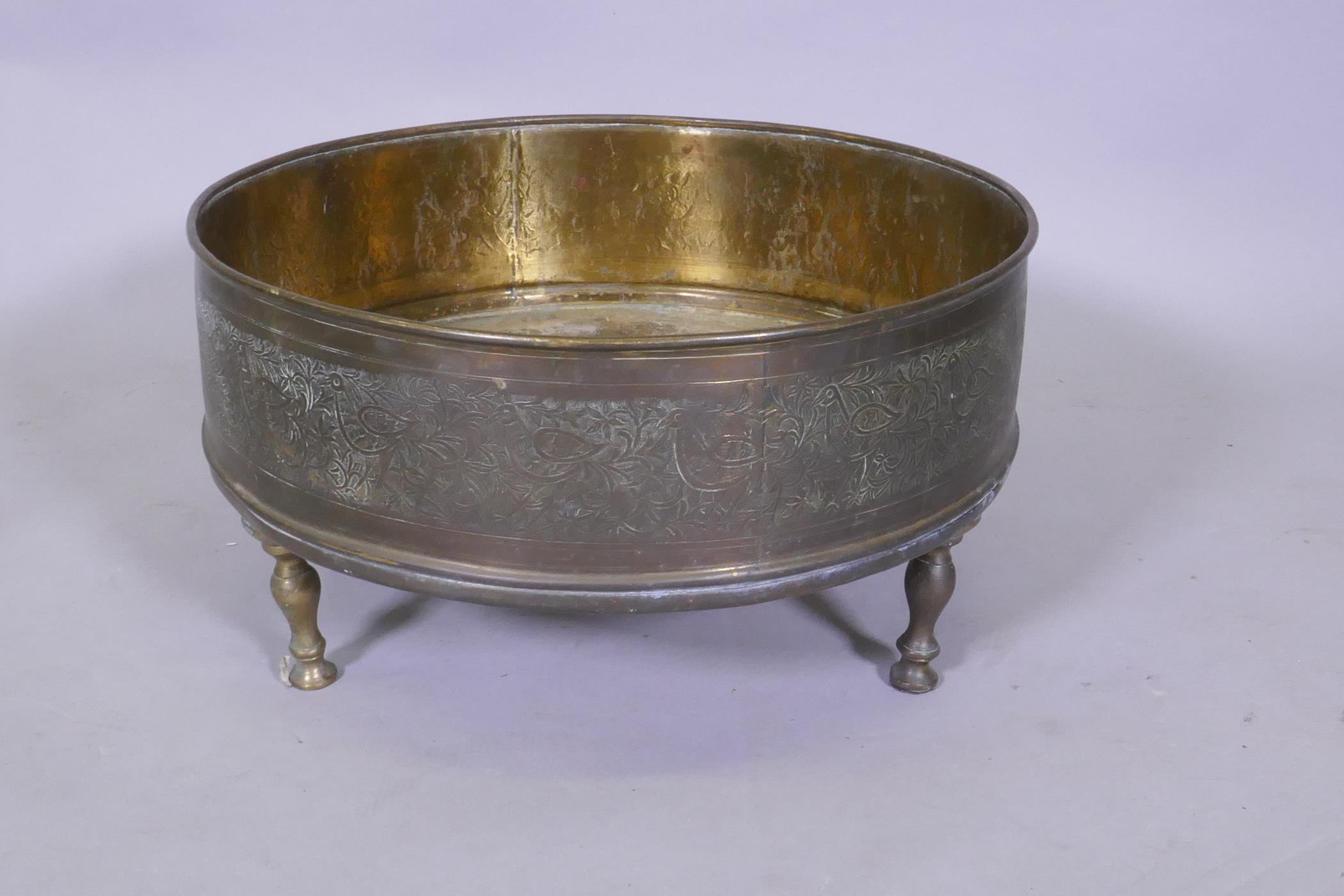 An antique Indo Persian brass brasserie and conical cover, raised on tripod supports, with chased - Image 4 of 6