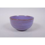 A Chinese jun ware style lilac flambe glazed bowl, 13cm diameter