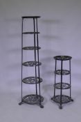 A painted metal pot stand, 123cm high, and another smaller