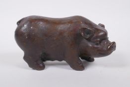 A Chinese filled bronze figure of a sow, impressed seal mark to base, 18cm long
