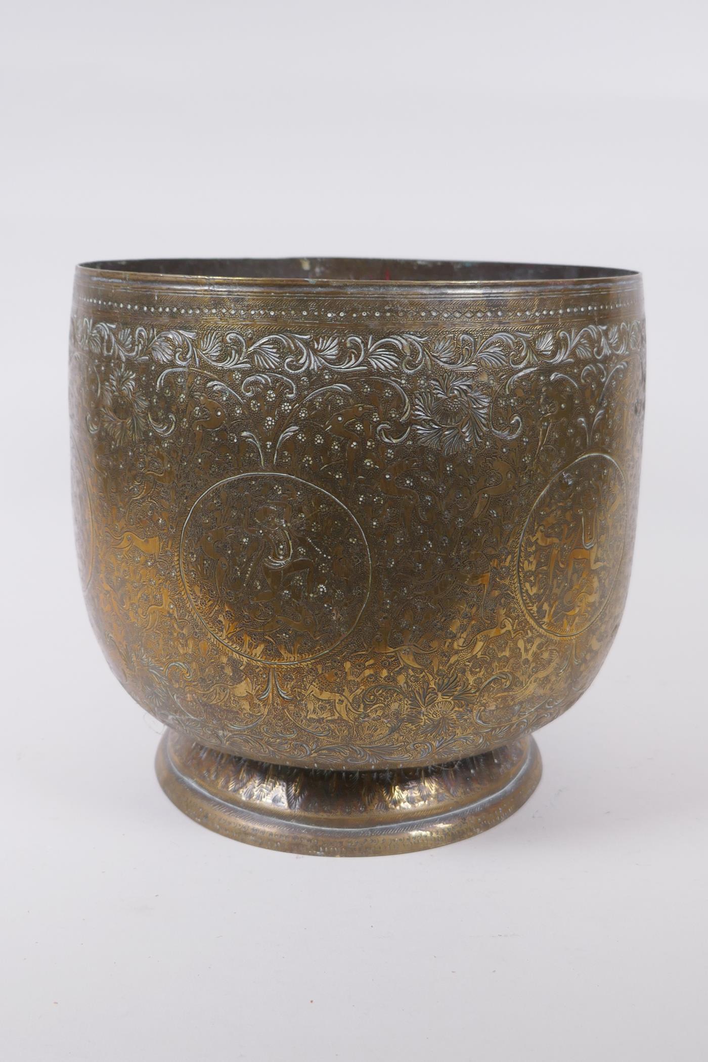 An antique Indo Persian brass planter with chased and hammered decoration of dancing figures and - Image 4 of 5