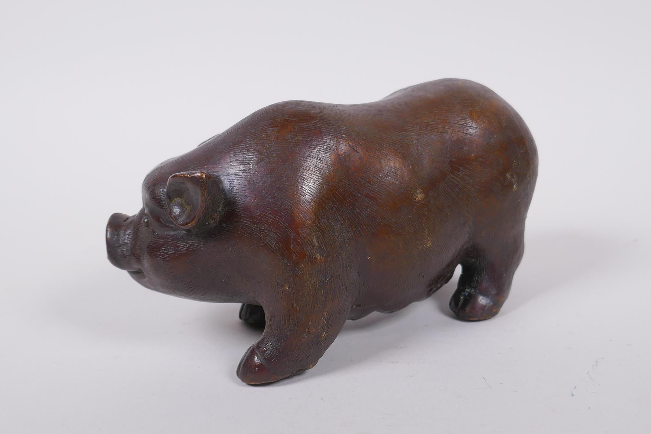 A Chinese filled bronze figure of a sow, impressed seal mark to base, 18cm long - Image 2 of 5