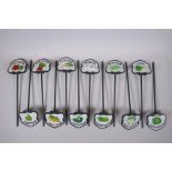 A set of 12 painted cast metal vegetable markers, 32cm long