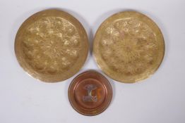 A pair of Indo Persian gilt brass trays with chased and hammered decoration, together with an