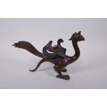 A Chinese filled bronze phoenix, 27cm long