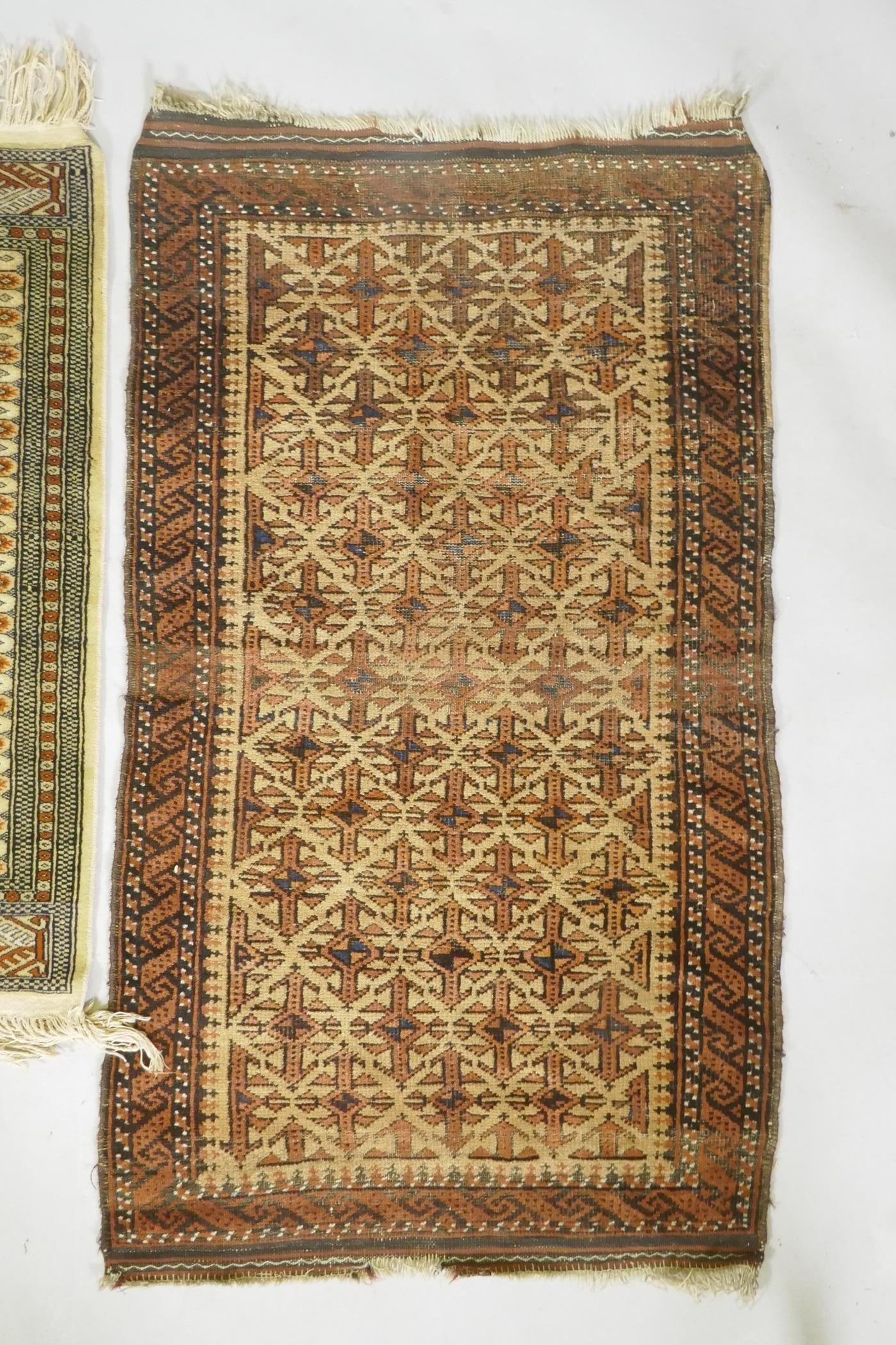 A gold ground Bokhara rug, and an Iranian rust and cream ground wool rug with an allover geometric - Image 2 of 7