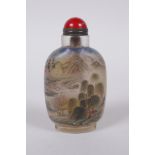 A Chinese reverse decorated glass snuff bottle, depicting figures in a landscape and birds by a lily