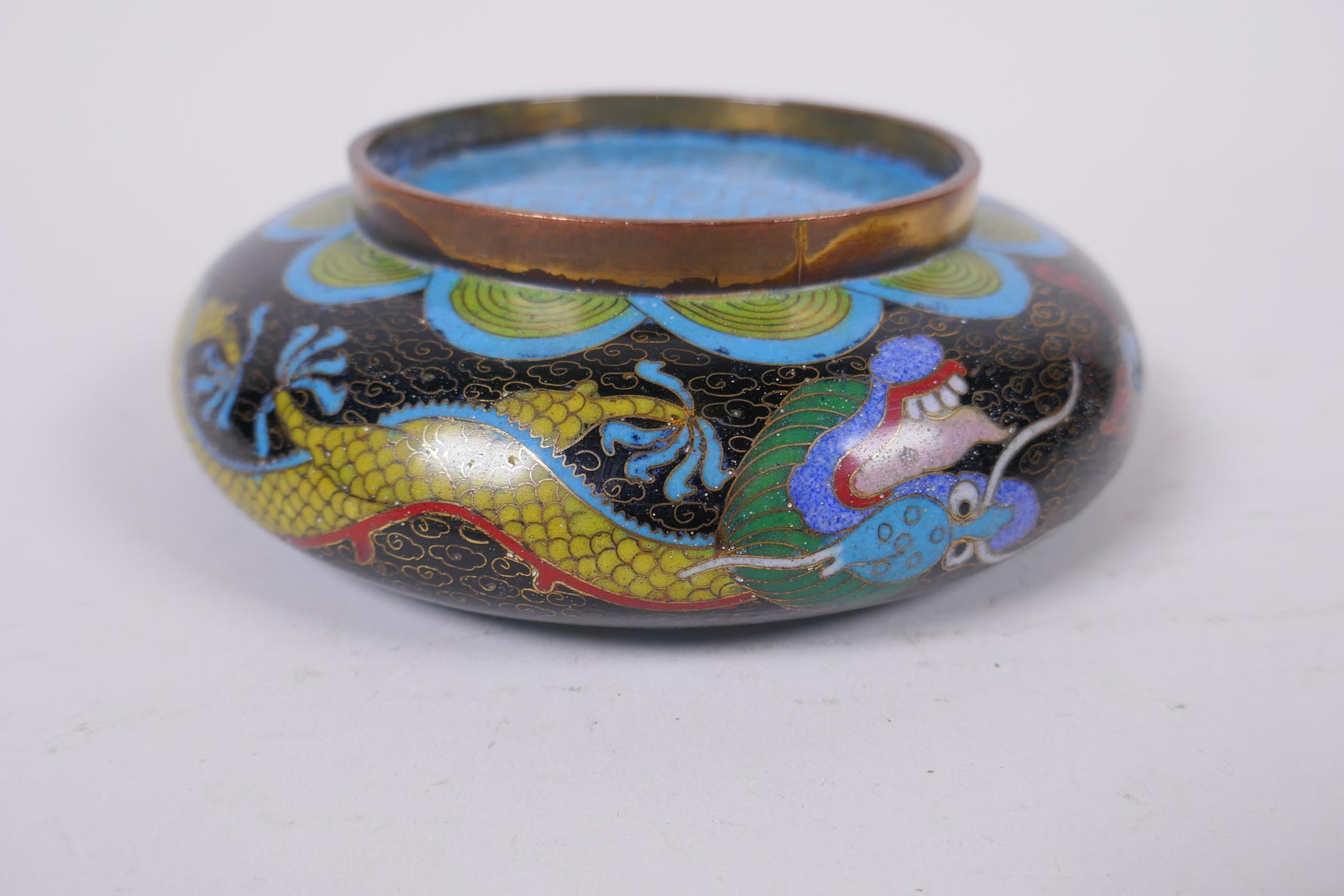 A Chinese black ground cloisonne bowl with rolled rim and dragon decoration, and a pair of Thai oval - Image 5 of 7