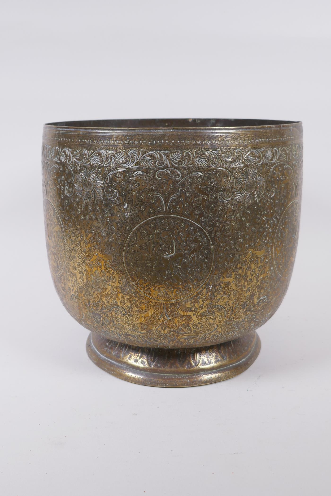 An antique Indo Persian brass planter with chased and hammered decoration of dancing figures and - Image 2 of 5