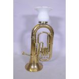 A brass tuba converted to a table lamp, 76cm high