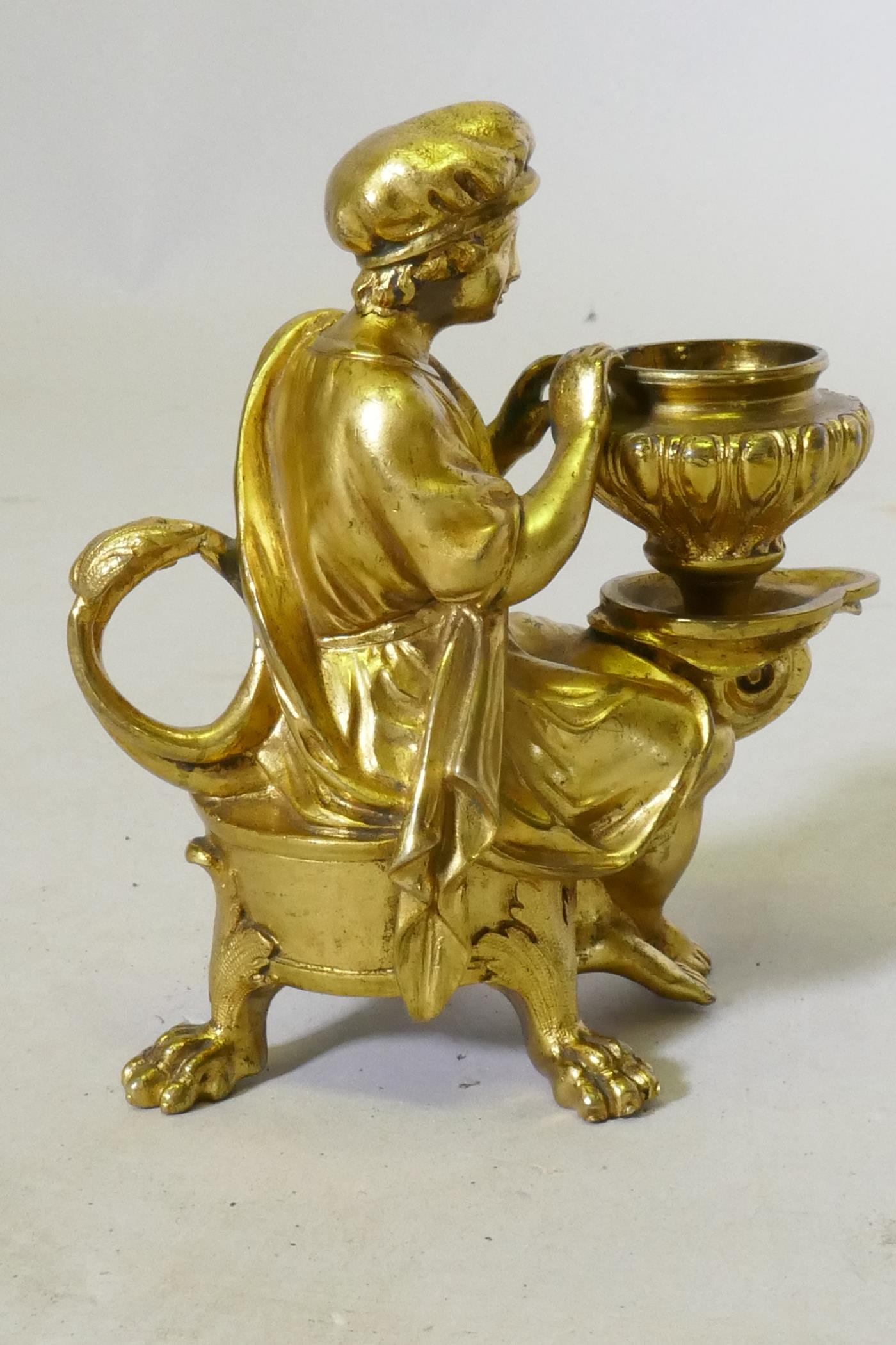 A fine Grand Tour ormolu bronze chamberstick in the form of a page seated upon a dolphin, C18th/ - Image 2 of 4