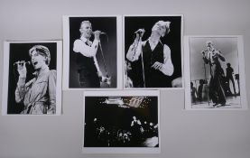 A collection of five black and white press photographs of David Bowie circa 1976, including one by