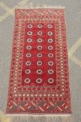 A red ground Turkmen Bokhara runner, 222 x 110cm