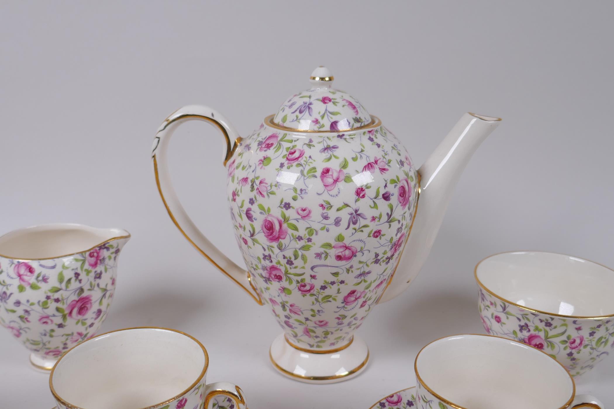 An Arklow pottery six piece coffee set with a transfer printed rose decoration, one cup different, - Image 2 of 7