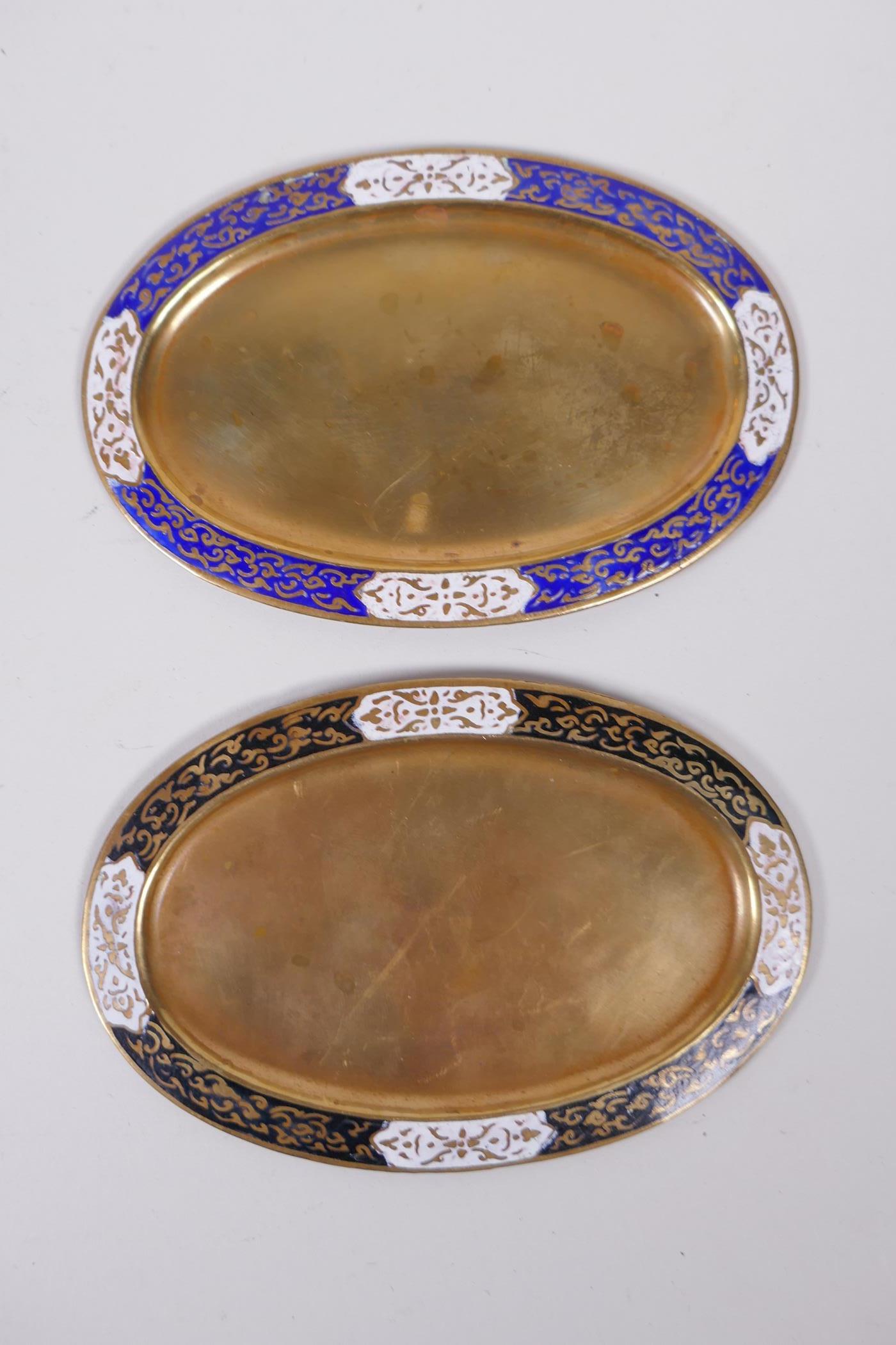 A Chinese black ground cloisonne bowl with rolled rim and dragon decoration, and a pair of Thai oval - Image 7 of 7