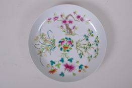 A Chinese late C19th famille rose porcelain cabinet plate decorated with peaches, bats, bamboo and