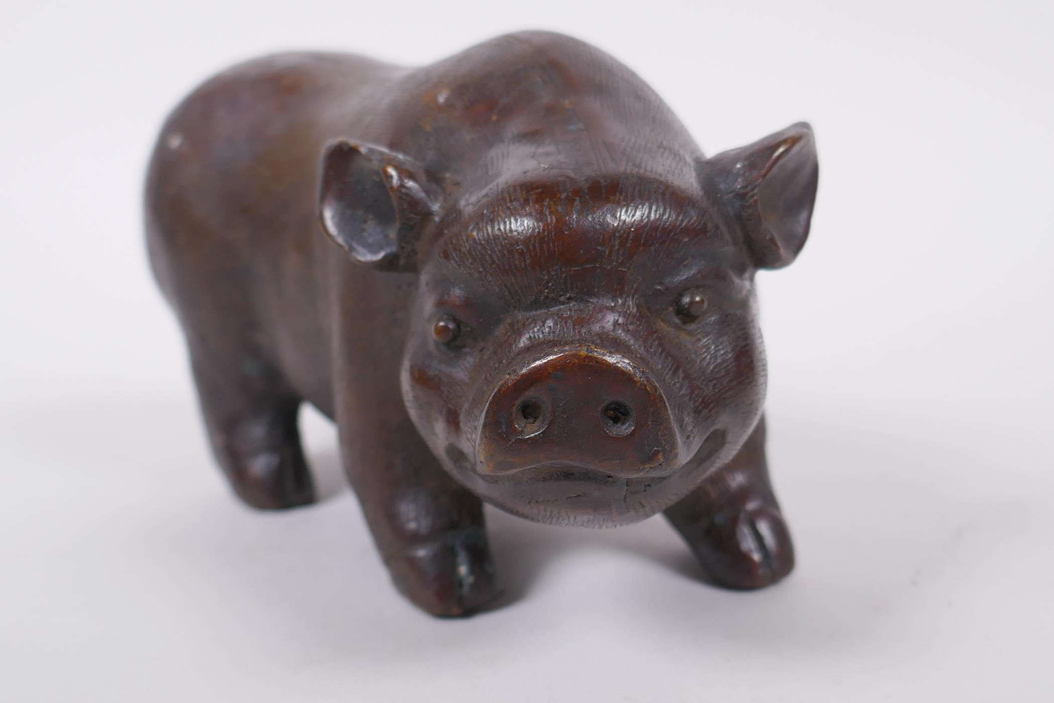 A Chinese filled bronze figure of a sow, impressed seal mark to base, 18cm long - Image 3 of 5