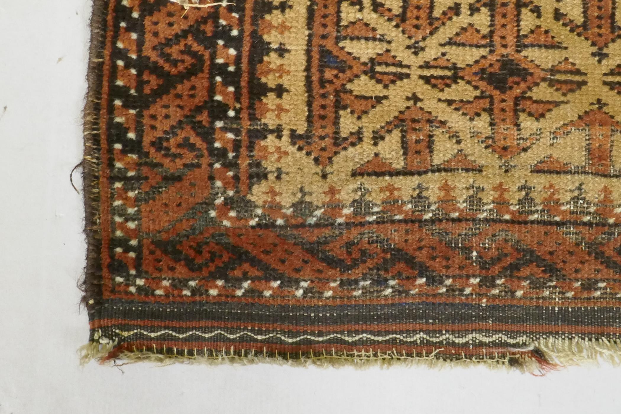 A gold ground Bokhara rug, and an Iranian rust and cream ground wool rug with an allover geometric - Image 4 of 7
