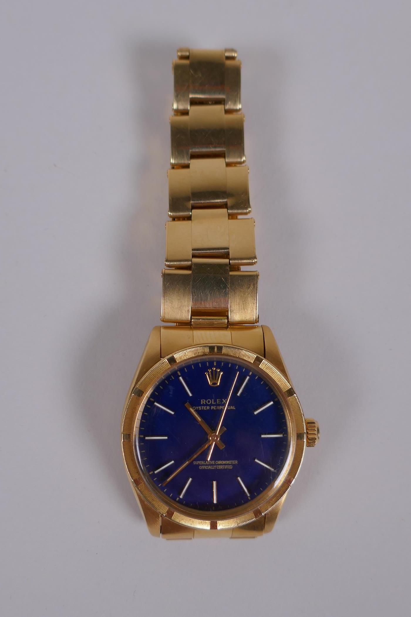 A gentleman's vintage 18ct gold Rolex Oyster Perpetual wrist watch with baton numerals, on a blue - Image 3 of 15