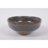A Chinese Jizhou kiln black glazed bowl, indistinct seal mark to base, 15cm diameter