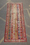 An antique multicolour Caucasian Shirvan runner, worn, 125 x 284cm