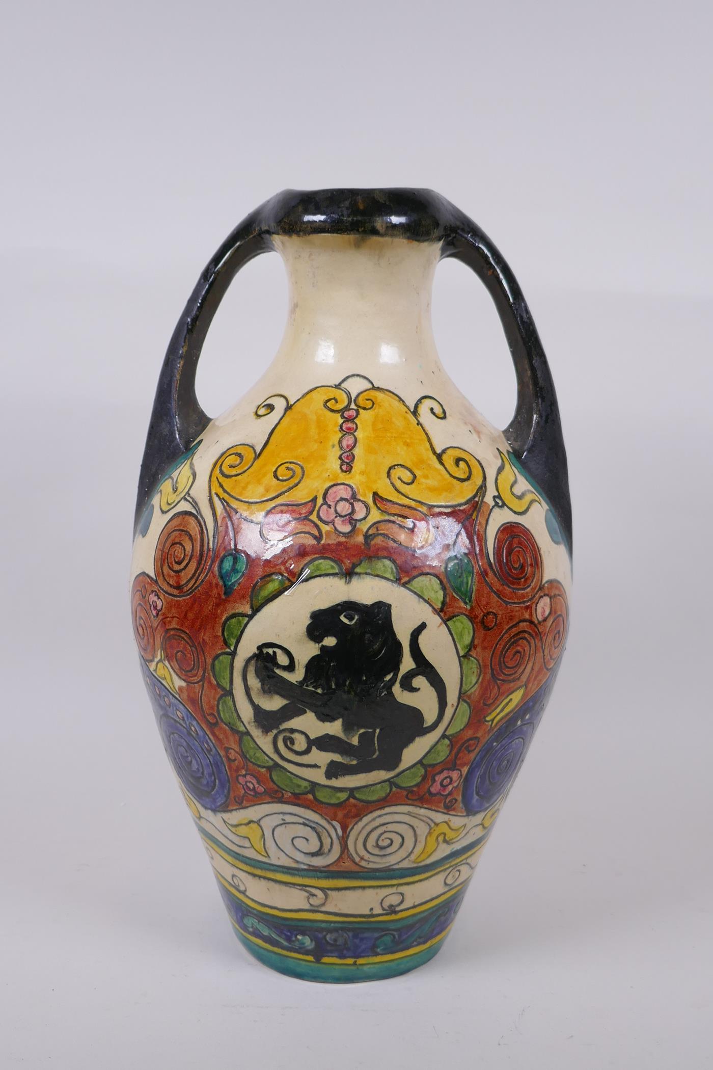 An Majolica amphora decorated with rampant lions, 38cm high