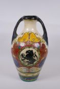 An Majolica amphora decorated with rampant lions, 38cm high