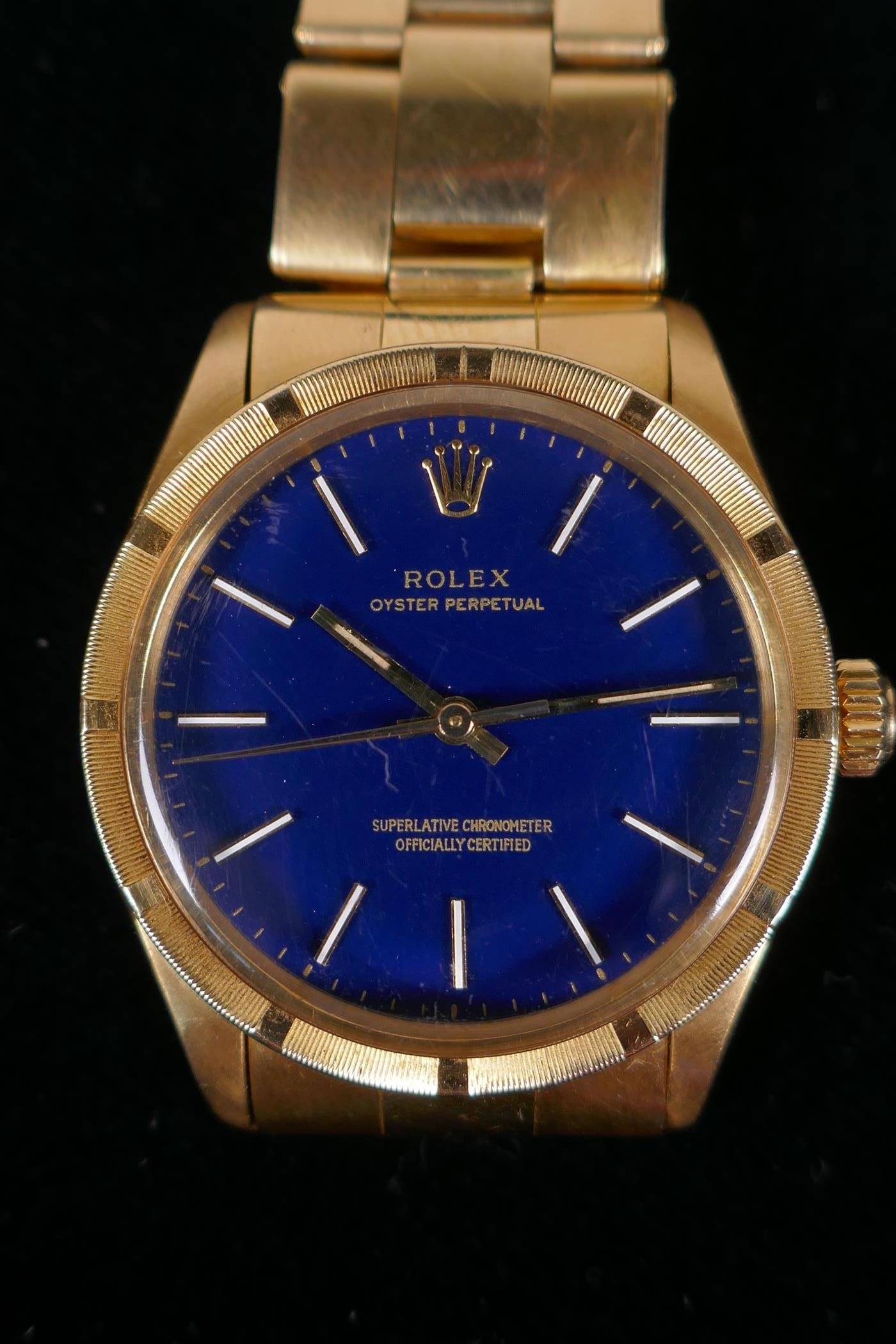 A gentleman's vintage 18ct gold Rolex Oyster Perpetual wrist watch with baton numerals, on a blue - Image 2 of 15