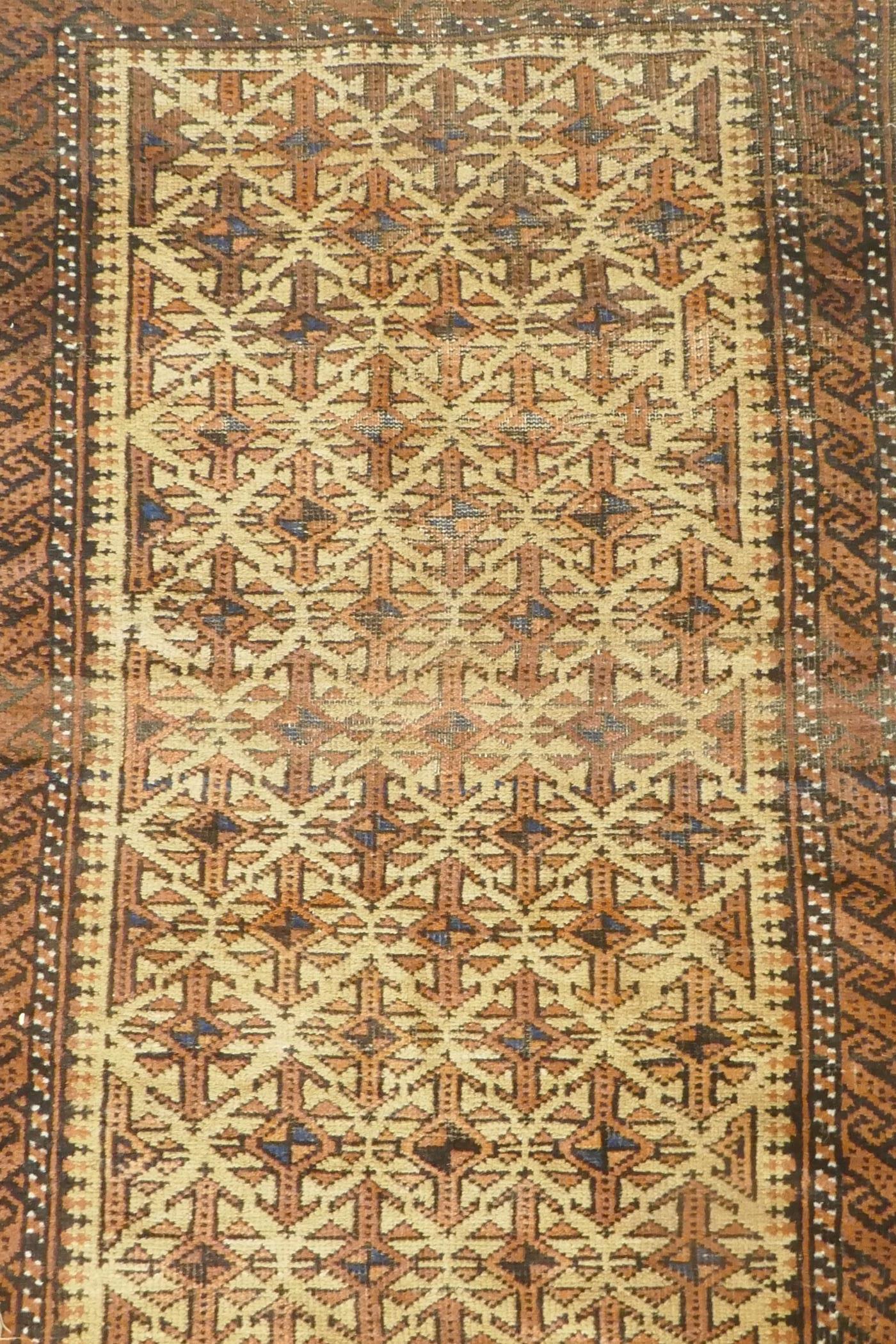 A gold ground Bokhara rug, and an Iranian rust and cream ground wool rug with an allover geometric - Image 3 of 7