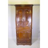 A Georgian painted pine standing corner cupboard in two sections, arched and fielded door panels,