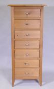 A contemporary seven drawer pine chest, 53 x 42 x 121cm
