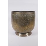 An antique Indo Persian brass planter with chased and hammered decoration of dancing figures and