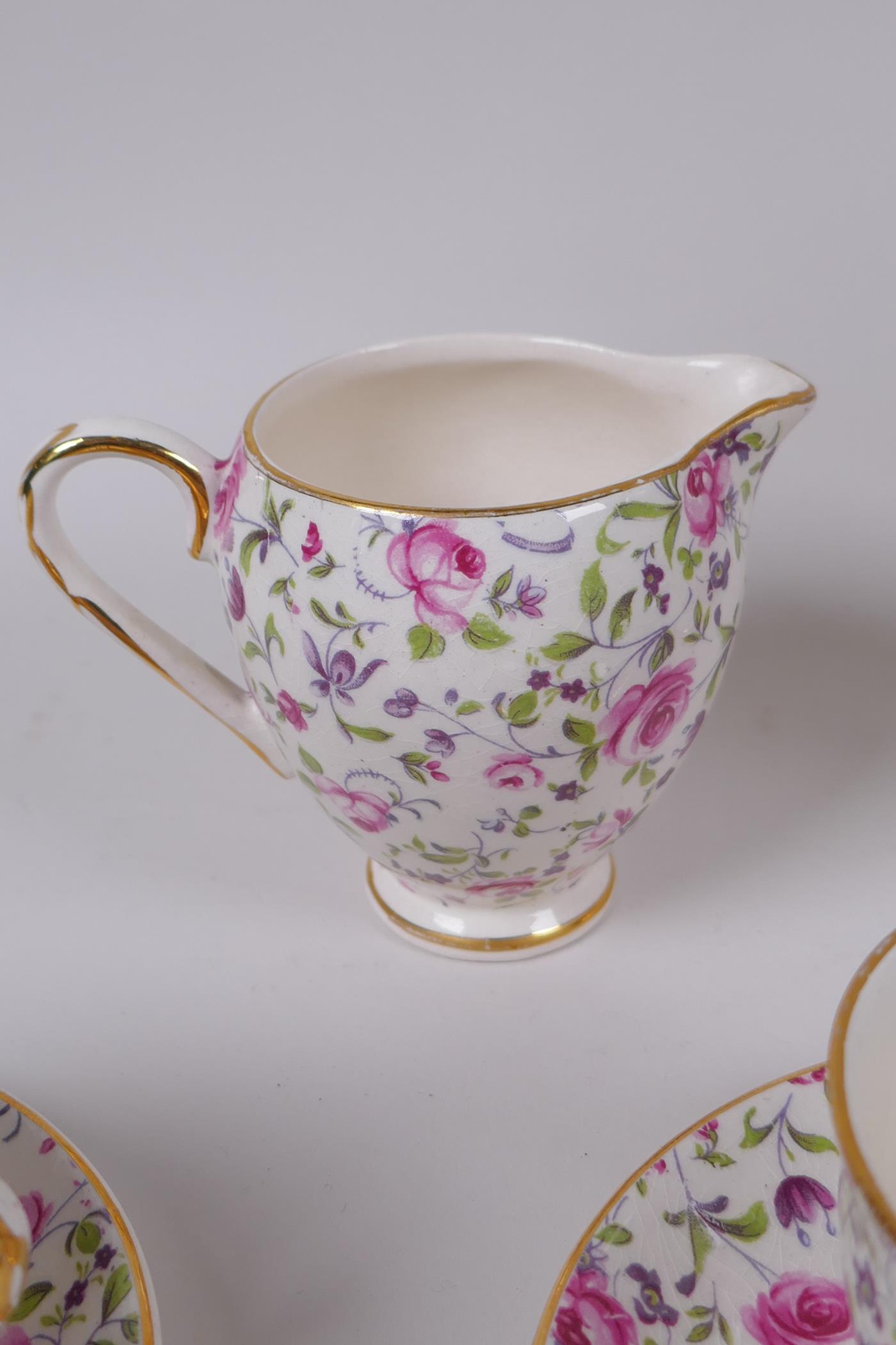 An Arklow pottery six piece coffee set with a transfer printed rose decoration, one cup different, - Image 4 of 7