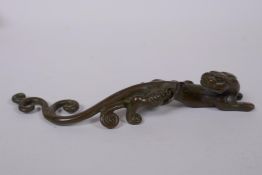 A Japanese style bronze okimono of a mythical beast, 16cm long