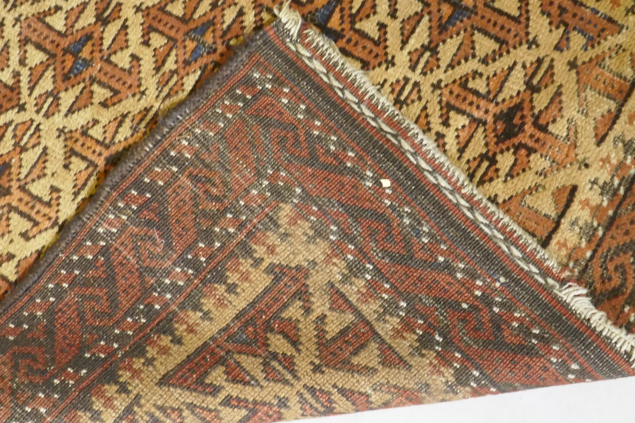 A gold ground Bokhara rug, and an Iranian rust and cream ground wool rug with an allover geometric - Image 5 of 7